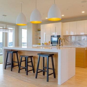 Modern Kitchen w/ White Quartz Countertops and Glossy White Cabinets