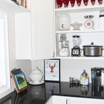 White Custom Pantry with Black Granite Countertops and Open Shelving