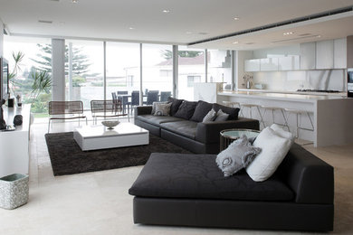 Design ideas for a contemporary open concept living room in Sydney with white walls and concrete floors.
