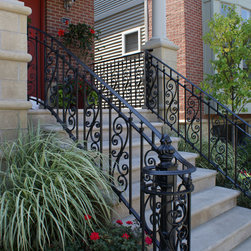 Solid stone stairs with ornamental iron railing - Products
