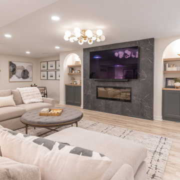 Warm & Inviting Basement Retreat with Custom Bar + Entertainment Center