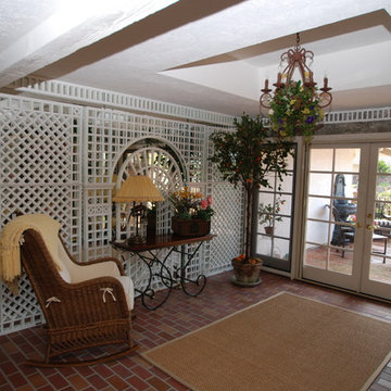 Garden Sunroom With Trompe-l'oeil Painting Walls & Trellis Over Mirror