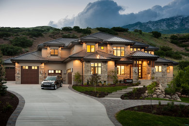 Design ideas for a mid-sized transitional two-storey brown exterior in Salt Lake City with stone veneer and a hip roof.