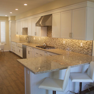 Relocated Kitchen Peninsula Sink Creates Expansive Open Kitchen