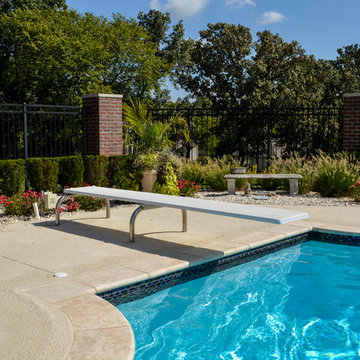 Grecian swimming pool with L, diving board and hot tub