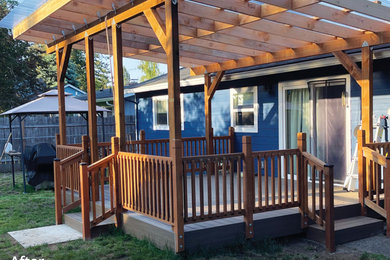 Mid-sized contemporary blue one-story vinyl and clapboard gable roof idea in Portland