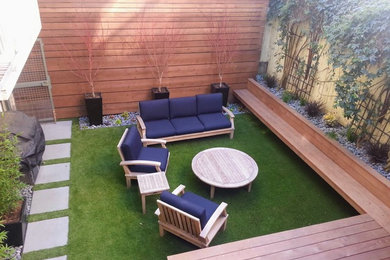 Design ideas for a small modern partial sun backyard concrete paver formal garden in San Francisco.