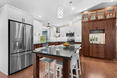 Example of a trendy l-shaped kitchen design in Other with an island