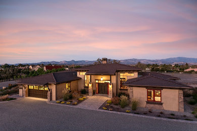 Inspiration for a huge transitional beige two-story stucco exterior home remodel in Santa Barbara