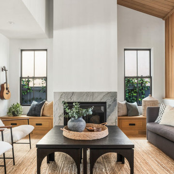A modern living room with fireplace and slat feature wall.
