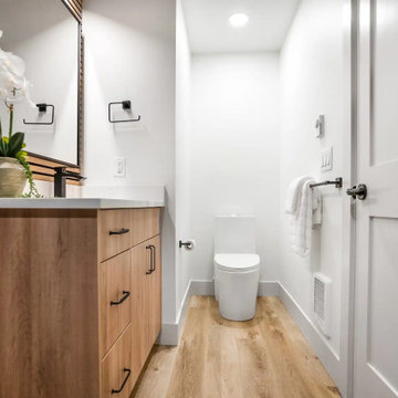 Powder Room with Wood Slat Wall, Oak Vanity and Black Fixtures – Beacon Hill