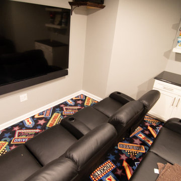 Basement Utilizing Open Space to Shoot Pool and Watch Favorite Sports Team