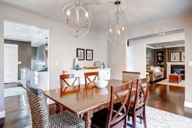 Enclosed dining room - large modern dark wood floor enclosed dining room idea in Salt Lake City with beige walls