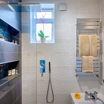 Wet room shower adjacent to bath