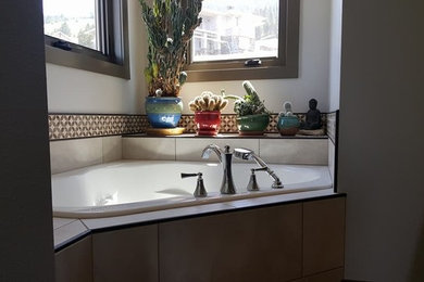 Inspiration for a contemporary corner bathtub remodel in Other
