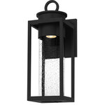 Quoizel - Donegal 1-Light Outdoor Wall Mount in Matte Black - Donegal's classic silhouette features an updated design that combines traditional style with industrial elements. A clear seeded glass cylinder surrounds the wall lantern's light source and directs the light for ideal ambient light. A durable Matte Black finish completes the look and makes for an easy addition to the outside of your home.  This light requires 1 , 7 Watt Bulbs (Not Included) UL Certified.