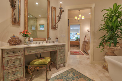 Large contemporary master bathroom in Austin with an undermount sink, furniture-like cabinets, distressed cabinets, marble benchtops, a freestanding tub, an open shower, white tile, beige tile, gray tile, white walls, marble floors, beige floor, an open shower, marble and a two-piece toilet.