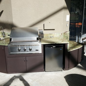 After : Custom built Outdoor Kitchen wrapped tastefully around the inside of the