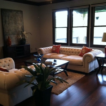 What a difference! Neutral chesterfields w/pops of color totally brightened this
