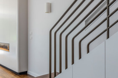 Mid-sized modern wood straight staircase in Sydney with wood risers and metal railing.