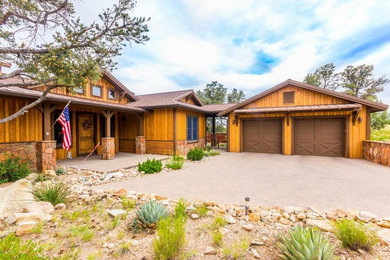 Example of a mountain style home design design in Orange County