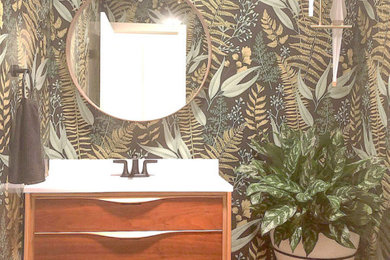Inspiration for a mid-sized mid-century modern dark wood floor and brown floor powder room remodel in San Diego with furniture-like cabinets, medium tone wood cabinets, multicolored walls, quartz countertops and white countertops