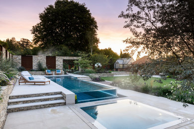 Inspiration for a medium sized contemporary swimming pool in Surrey.