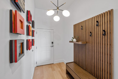 Inspiration for a mid-sized 1950s entryway remodel in Portland Maine with white walls