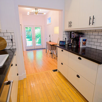 Galley Kitchen View Toward Bright Dining-Room Patio Doors | East York