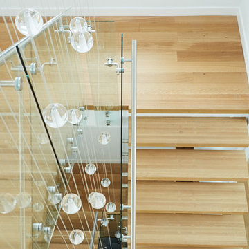 white oak mono stringer with stainless steel hand rail