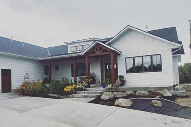 Example of a classic white gable roof design in Other with a shingle roof and a blue roof