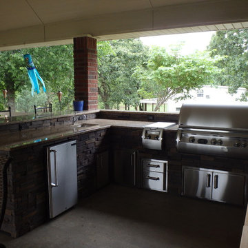 L Shaped Outdoor Kitchen With Unique Lighting