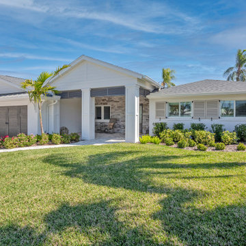 Contemporary Ranch-Style Entry With Covered Patio and Low-Maintenance Outdoor De