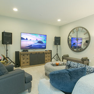 This is an example of a medium sized classic enclosed home cinema in Dallas with grey walls, carpet, a wall mounted tv and grey floors.