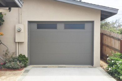 Mid-sized contemporary attached one-car garage in San Diego.