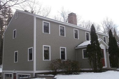 Inspiration for a mid-sized timeless brown two-story concrete fiberboard exterior home remodel in Manchester