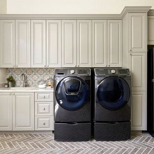 This is an example of an expansive traditional single-wall separated utility room in Austin with a submerged sink, raised-panel cabinets, engineered stone countertops, a side by side washer and dryer, white worktops and beige cabinets.