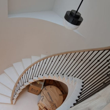 Oak handrail on a stone staircase