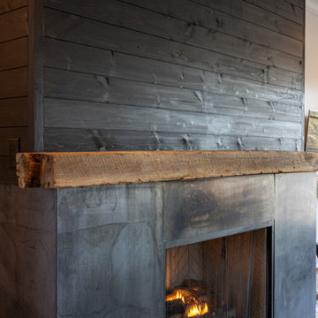 Black shiplap/steel fireplace