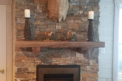 Valor Portrait with stacked stone and recovered barnwood mantle