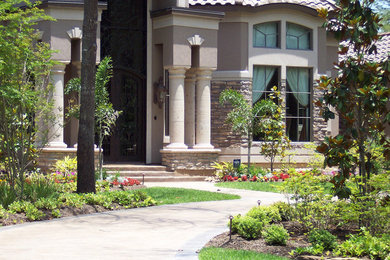 Example of a huge tuscan white two-story stucco exterior home design in Houston with a hip roof