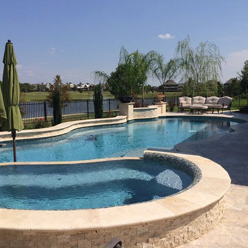 Travertine Freeform Pool with a view in Cypress