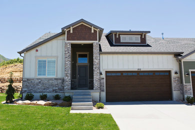 Transitional two-story concrete fiberboard exterior home idea in Salt Lake City with a shingle roof