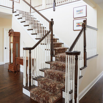 Traditional Open Stair with Painted Risers, Balusters, and Carpet Runner