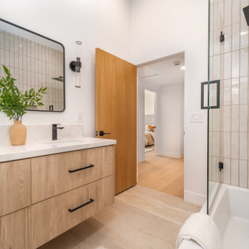 Floating Oak Double Vanity Beside the Tub and Shower