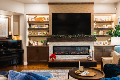 Example of a transitional shiplap wall living room design in Austin with beige walls and a stacked stone fireplace