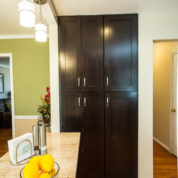 Espresso Kitchen Remodel with Granite Island and Stainless Steel Appliances