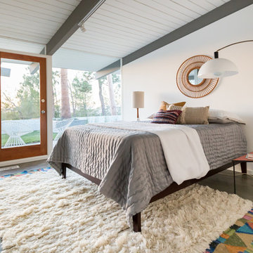 Vintage Arc Lamp in Bedroom with Pink Accents