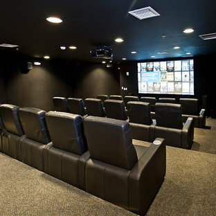 Home theater - large contemporary enclosed home theater idea in Kansas City with a projector screen and gray walls
