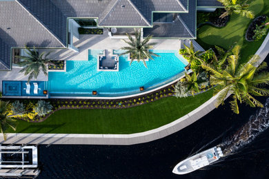 Example of a transitional home design design in Miami
